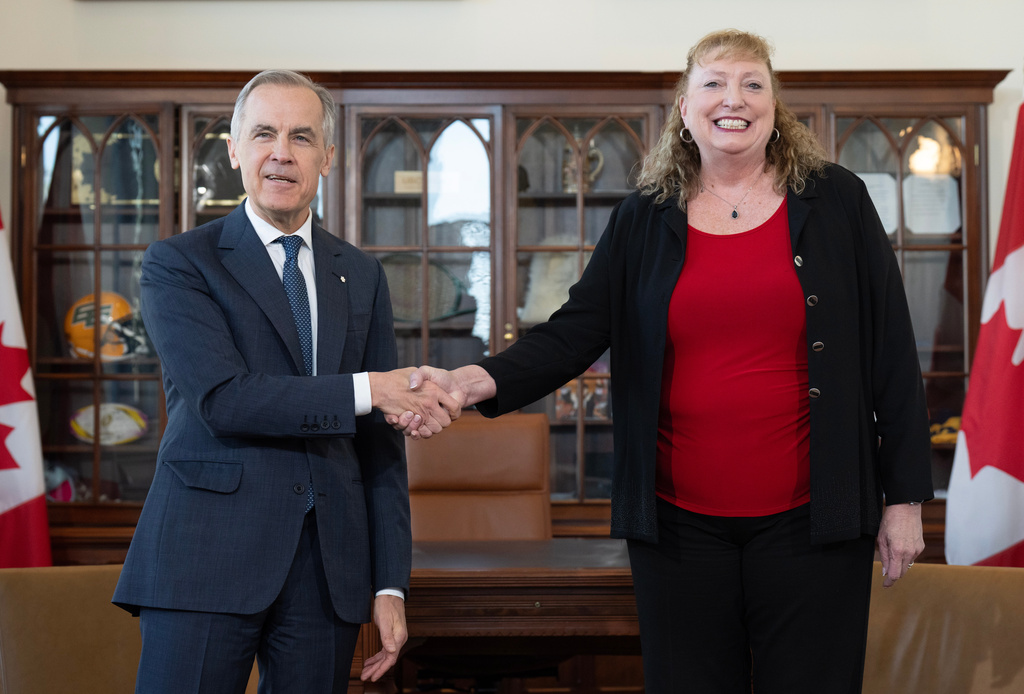 Prime Minister Mark Carney shakes hands with MP for Sarnia-Lambton-Bkejwanong Marilyn Gladu in Ottawa, Wednesday, April 8, 2026. (Adrian Wyld /The Canadian Press via AP)