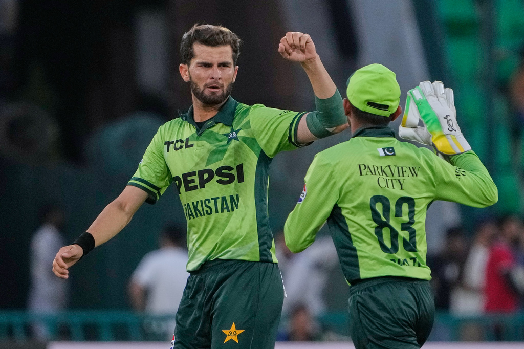 Pakistan's Shaheen Shah Afridi, left, celebrates with teammate after the dismissal of Australia's Cameron Green during the third one-day international cricket match between Pakistan and Australia, in Lahore, Pakistan, Thursday, June 4, 2026. (AP Photo/K.M. Chaudary)