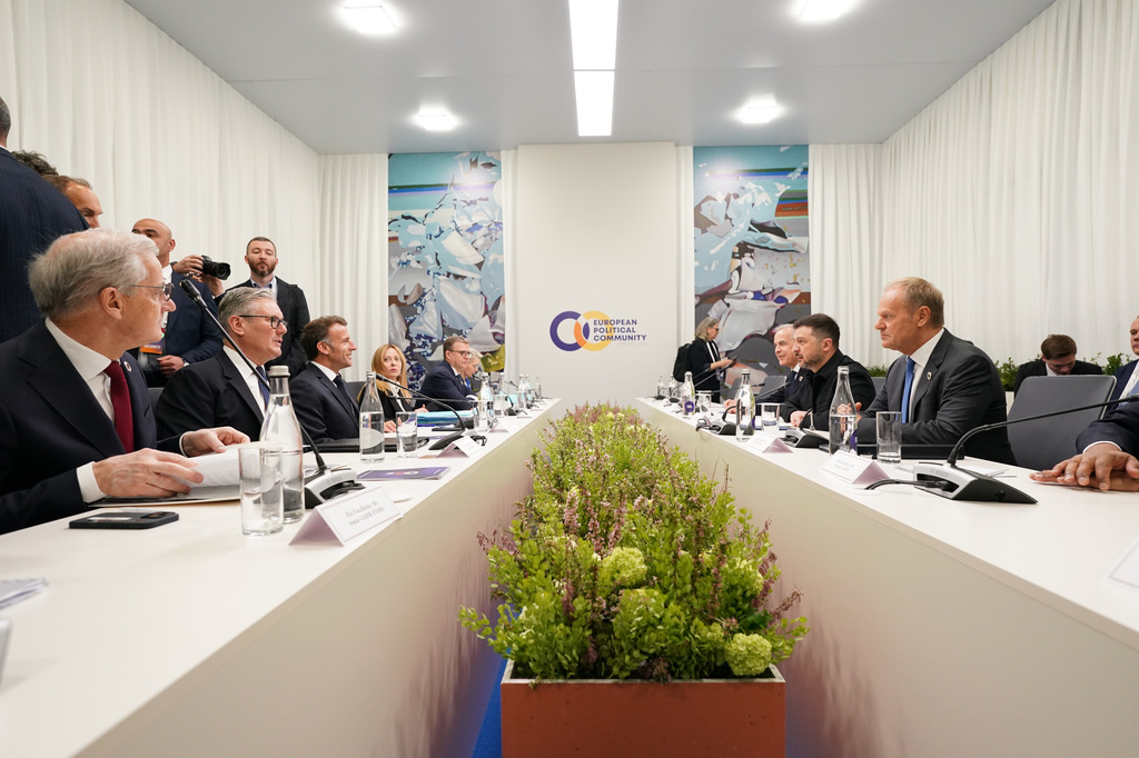 Ukraine's President Volodymyr Zelenskyy, second right, sits opposite Britain's Prime Minister Keir Starmer, second left, and France's President Emmanuel Macron, third left, during the Ukraine multi-lateral meeting, co-chaired by UK and France at the European Political Community summit in Yerevan, Armenia, Monday May 4, 2026. (Stefan Rousseau/Pool Photo via AP)