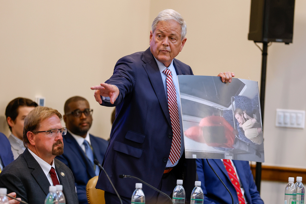 Rep. Ralph Norman (R-SC) holds a print showing the moment before Iryna Zarutska was murdered on a Charlotte light rail train at the House Judiciary Subcommittee on Oversight hearing on violent crime in Charlotte, N.C., Monday, Sept. 29, 2025. (AP Photo/Nell Redmond)