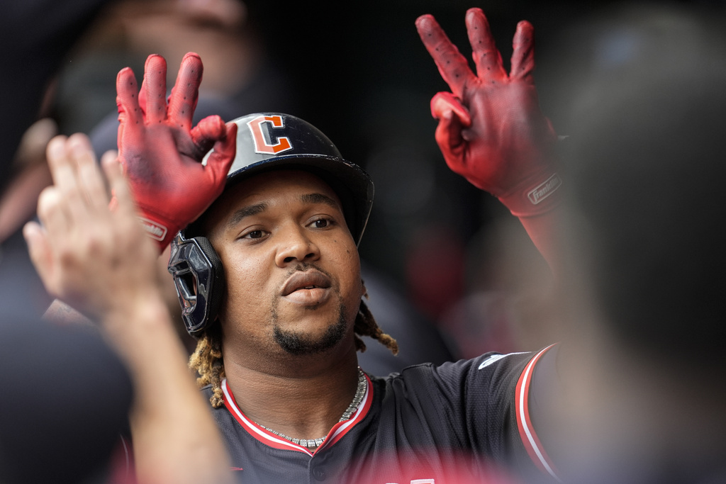 Cleveland Guardians' José Ramírez (11) celebrates his solo home run against the Minnesota Twins in the first inning of a baseball game, Saturday, Sept. 20, 2025, in Minneapolis. (AP Photo/Mike Stewart)