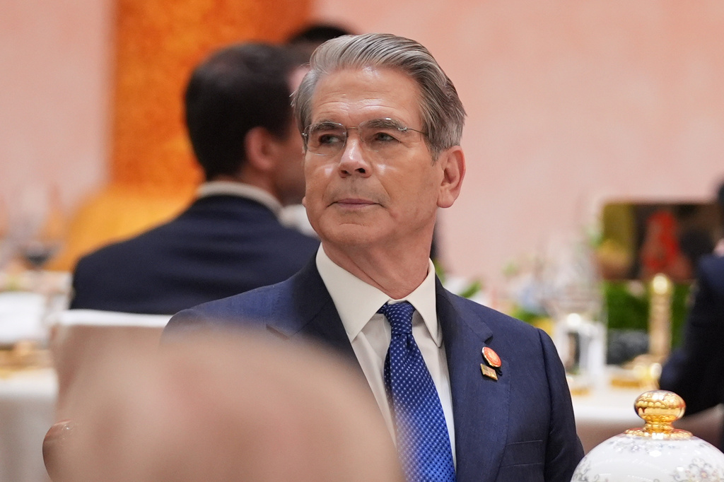 Treasury Secretary Scott Bessent listens during a state dinner with President Donald Trump and Chinese President Xi Jinping at the Great Hall of the People on Thursday May 14, 2026, in Beijing. (AP Photo/Mark Schiefelbein)