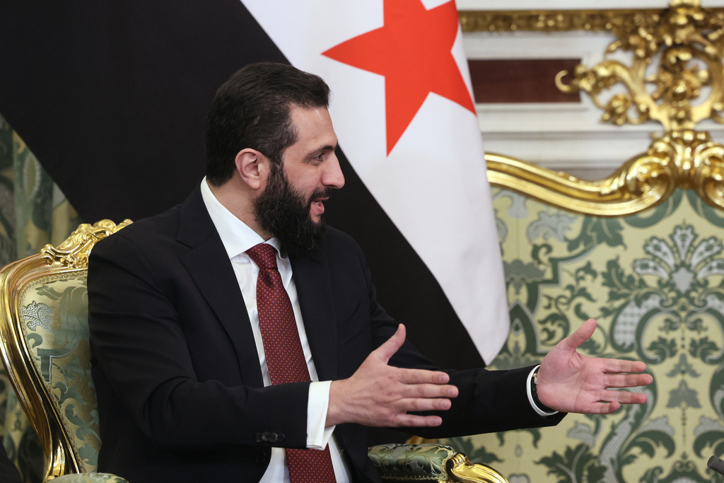 Syrian interim President Ahmad al-Sharaa gestures while speaking to Russian President Vladimir Putin during their meeting at the Grand Kremlin Palace in Moscow, on Wednesday, Jan. 28, 2026. (Maxim Shipenkov/Pool Photo via AP)