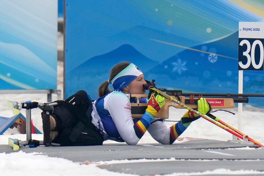 FILE - Anja Wicker of Germany shoots during the women's individual sitting event of para biathlon at the 2022 Winter Paralympics, Friday, March 11, 2022, in Zhangjiakou, China. (AP Photo/Shuji Kajiyama, file)
