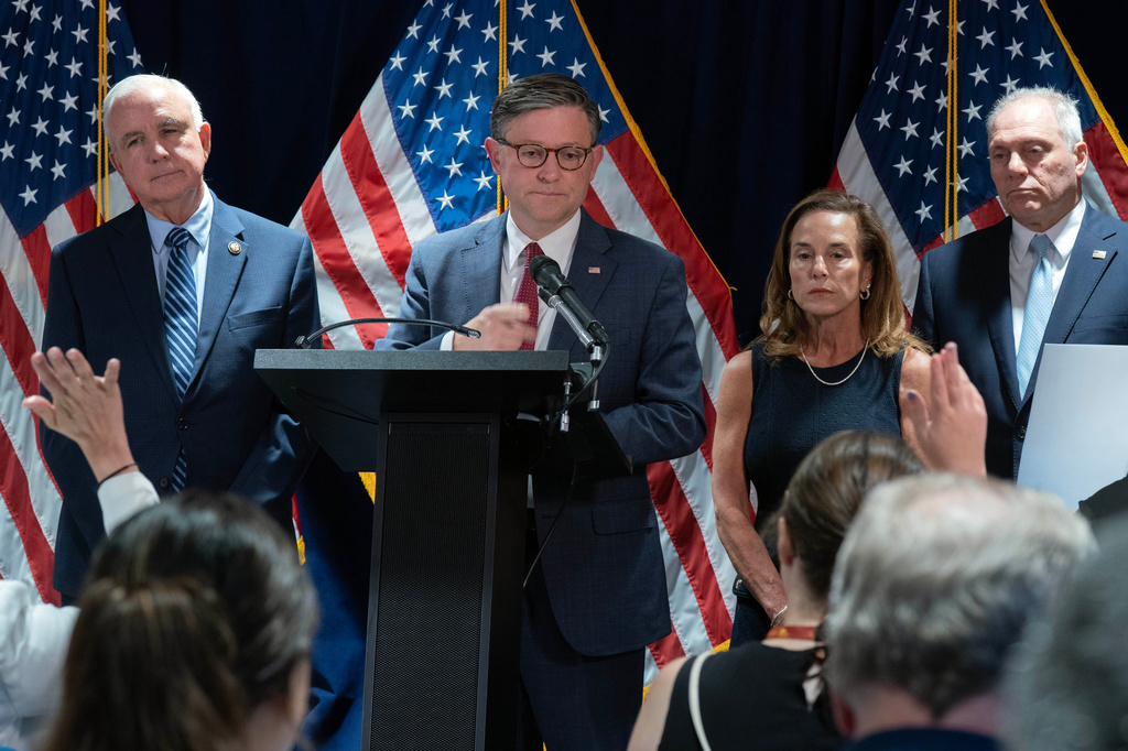 Speaker of the House Mike Johnson, R-La., flanked by Rep. Carlos Giménez R-Fla., from left, Chair of the House Republican Conference, Rep. Lisa McClain, R-Mich., and House Majority Leader Steve Scalise, R-La., speaks during a news conference on Capitol Hill, Tuesday, July 14, 2026, in Washington. (AP Photo/Jose Luis Magana)