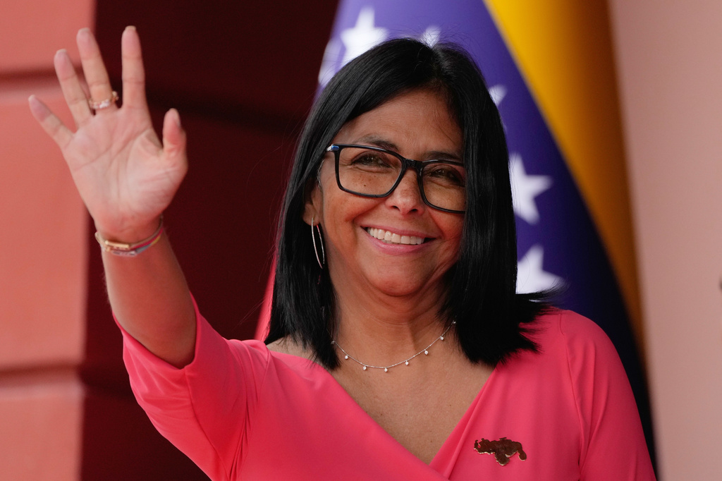 FILE - Venezuela's acting President Delcy Rodriguez waves as she waits for Colombian President Gustavo Petro at Miraflores Palace in Caracas, Venezuela, Friday, April 24, 2026. (AP Photo/Ariana Cubillos, File)