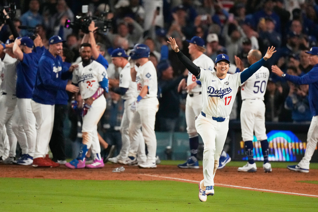 Los Angeles Dodgers' Shohei Ohtani celebrates their win against the Toronto Blue Jays during the 18th inning in Game 3 of baseball's World Series, Monday, Oct. 27, 2025, in Los Angeles. (AP Photo/Mark J. Terrill)