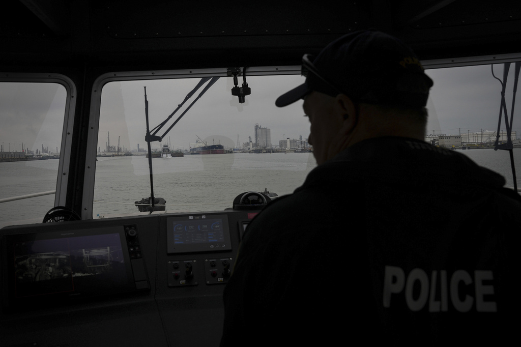 A Port of Corpus Christi police officer guides a boat through the port Thursday, Nov. 16, 2023, in Corpus Christi, Texas. (Jon Shapley/Houston Chronicle via AP)