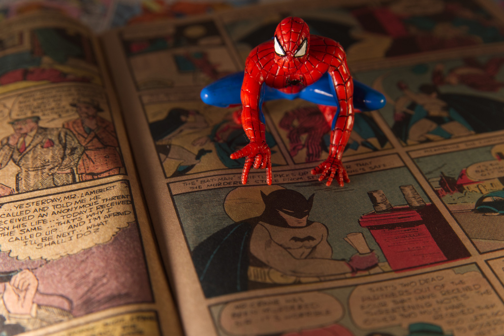 A Spiderman figurine sits atop a facsimile copy of the May 1939 Detective Comics anthology series in Phoenix, Thursday May 14, 2026. This issue made history for including the debut of the Batman superhero in a story called "The Case of the Chemical Syndicate". (AP Photo/Dario Lopez-Mills)