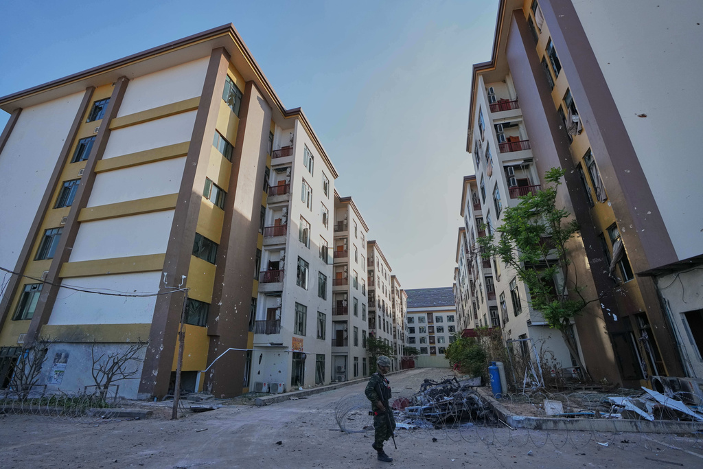 FILE - A Thai soldier keeps guard outside a scam center in O'Smach, Cambodia, Monday, Feb. 2, 2026, (AP Photo/Sakchai Lalit, File)