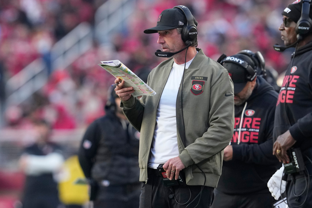 San Francisco 49ers head coach Kyle Shanahan looks onto the field during the second half of an NFL football game against the Tennessee Titans, Sunday, Dec. 14, 2025, in Santa Clara, Calif. (AP Photo/Godofredo A. Vásquez)