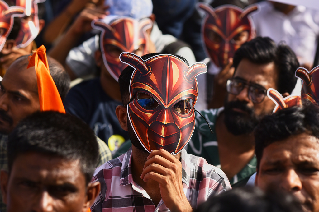 A participant wearing a cockroach mask takes part in a nationwide protest campaign launched by Abhijeet Dipke, founder of the Cockroach Janta Party, in Pune, India, Thursday, June 11, 2026. (AP Photo/Mahendra Kolhe)