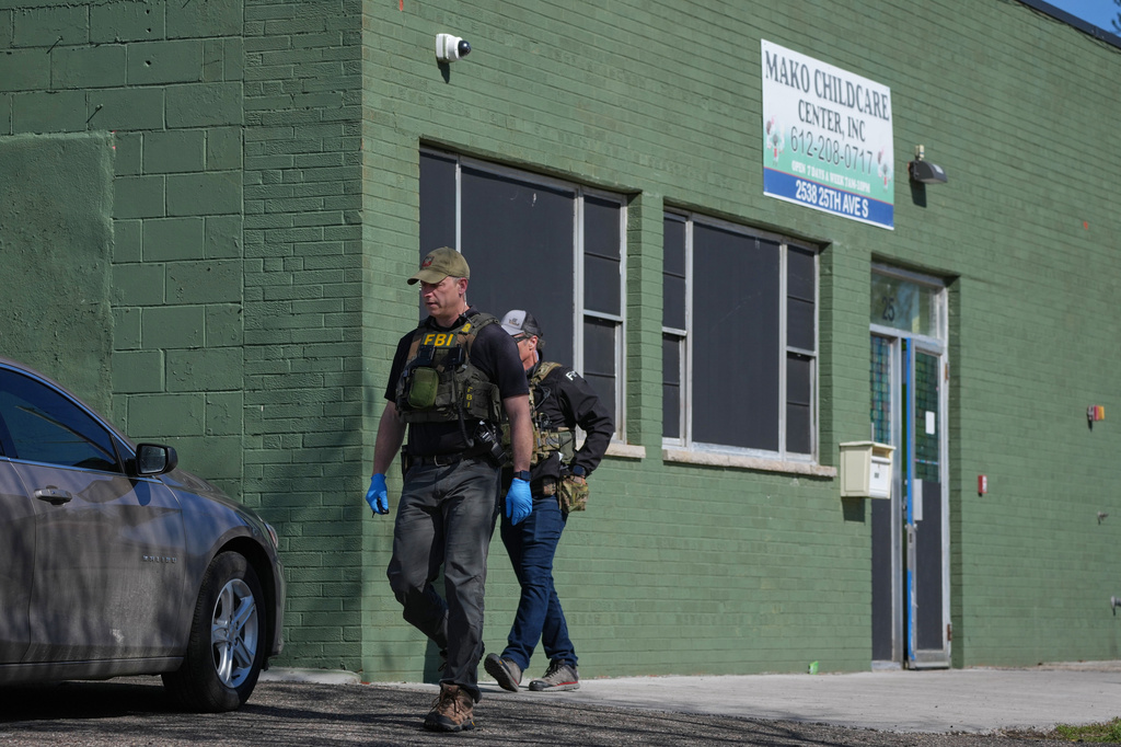 FBI agents walk outside the Mini Child Care Center (formerly Mako Childcare) in Minneapolis, Minn. on Tuesday, April 28, 2026. (Anthony Soufflé/Minnesota Star Tribune via AP) CORRECTION: Mini Child Care, not Mako Child Care