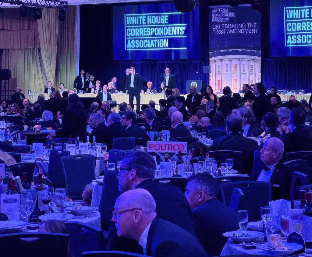 FILE - U.S. Secret Service agents respond near President Donald Trump and first lady Melania Trump during the White House Correspondents Dinner, in Washington, April 25, 2026. (AP Photo/Alex Brandon, File)