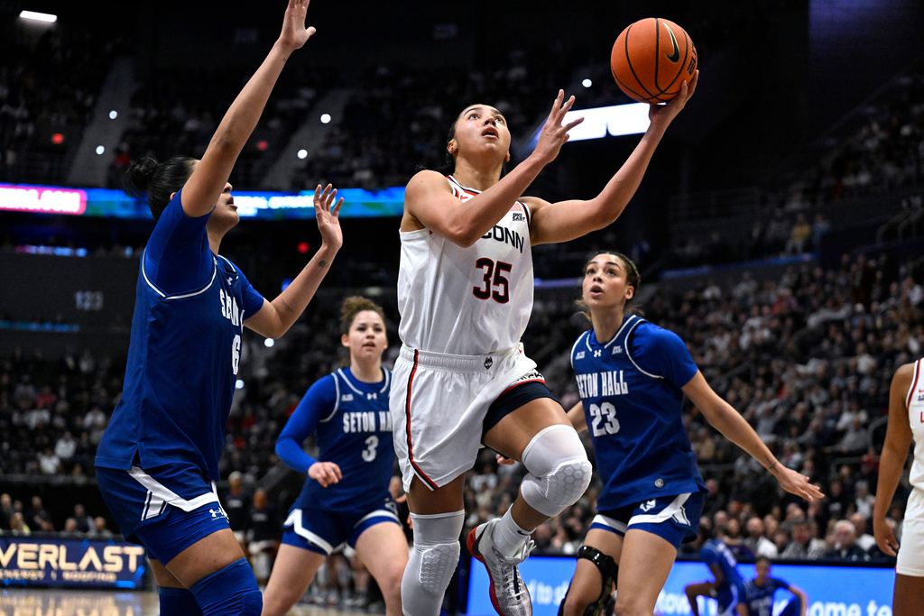 UConn guard Azzi Fudd (35) shoots against Seton Hall in the first half of an NCAA college basketball game, Saturday, Jan. 3, 2026, in Hartford, Conn. (AP Photo/Jessica Hill)