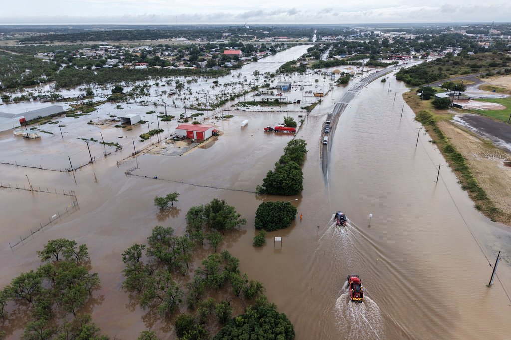 An aerial view shows flooding on Friday, July 17, 2026, in Ozona, Texas. (AP Photo/Gerald Herbert)