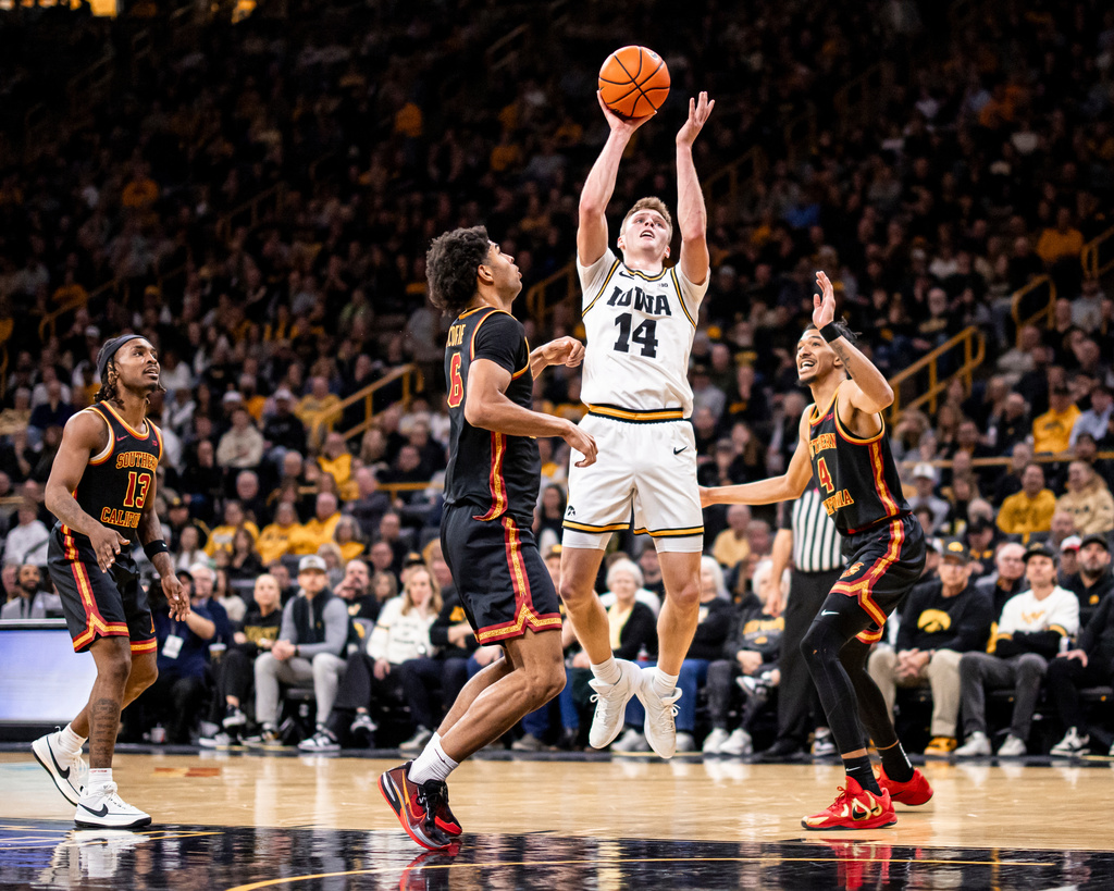 Iowa guard Bennett Stirtz (14) shoots against USC during an NCAA college basketball game, Wednesday, Jan. 28, 2026. (Nick Rohlman/The Gazette via AP)