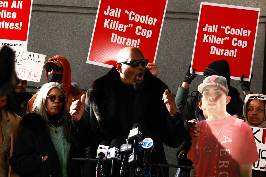 Hawk Newsome speaks accompanied by Gretchen Sotoaw, the mother of Eric Duprey, outside the Bronx Criminal Court in New York, Friday, Feb. 6, 2026, after New York police officer Erik Duran who was convicted of manslaughter after he tossed a picnic cooler filled with drinks at a fleeing Duprey, causing him to fatally crash his motorized scooter. (AP Photo/Kena Betancur)