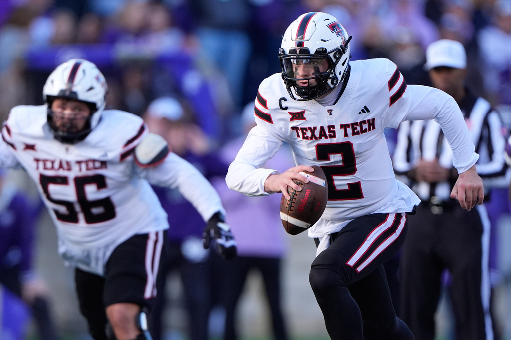 Texas Tech quarterback Behren Morton (2) runs the ball during the first half of an NCAA college football game against Kansas State, Saturday, Nov. 1, 2025, in Manhattan, Kan. (AP Photo/Charlie Riedel)