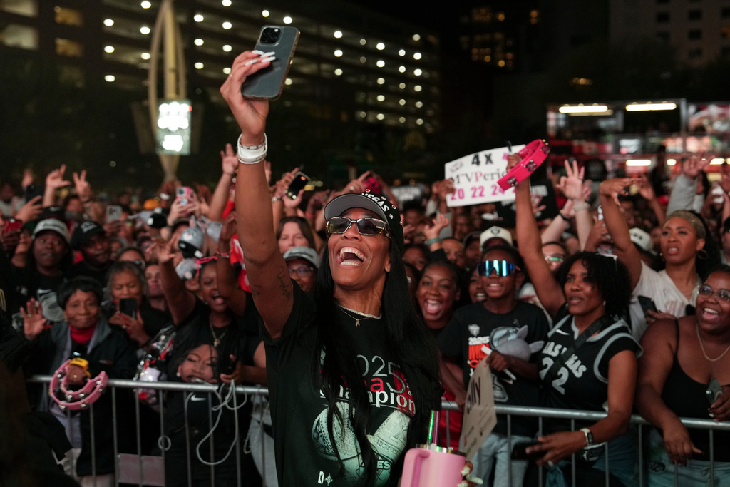 Las Vegas Aces forward A'ja Wilson celebrates during a rally to celebrate the team's WNBA championship Friday, Oct. 17, 2025, in Las Vegas. (AP Photo/Candice Ward)