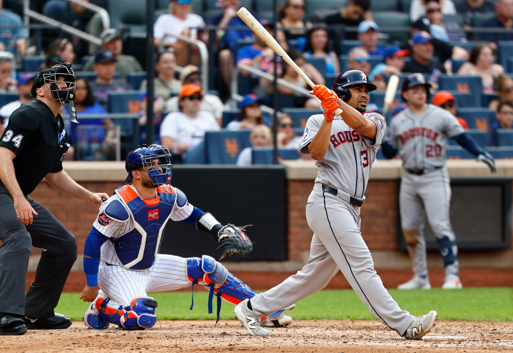 Houston Astros left fielder LaMonte Wade Jr. follows through on a home run during the sixth inning of a baseball game against the New York Mets, Sunday, Aug. 30, 2026, in New York. (AP Photo/Noah K. Murray)