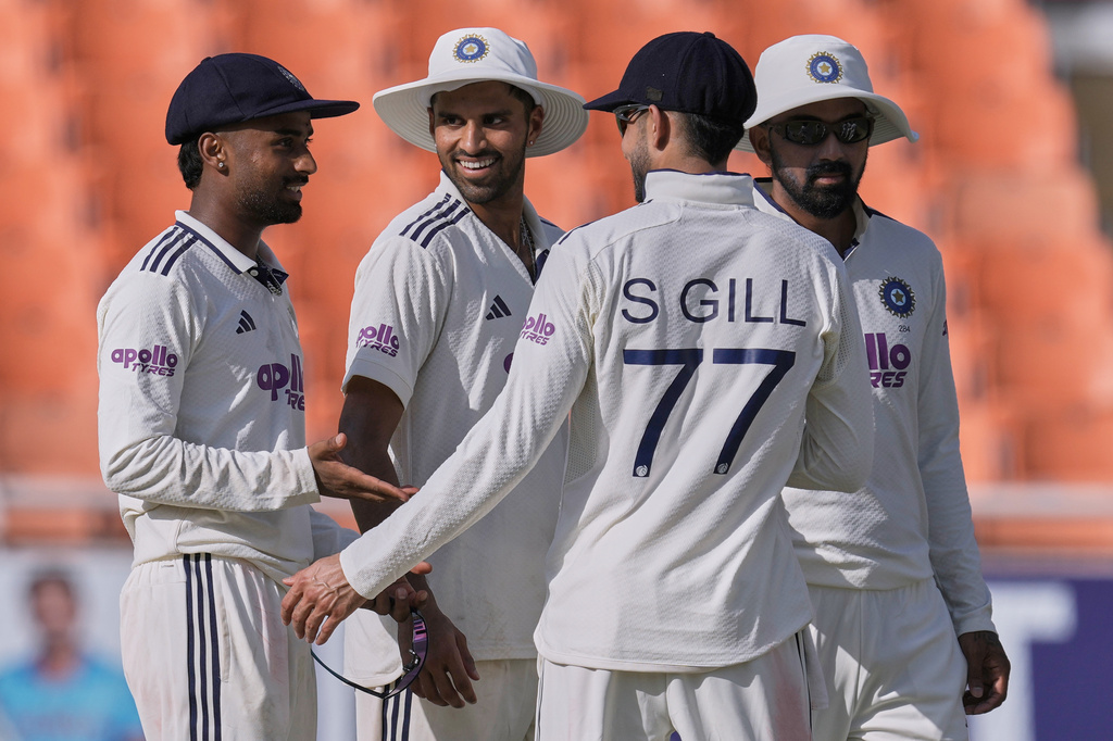 India's Manav Suthar, left, celebrates with teammates the wicket of Afghanistan's Afsar Zazai on day two of the cricket test match between Afghanistan and India in New Chandigarh, India, Sunday, June 7, 2026. (AP Photo/Ashwini Bhatia)