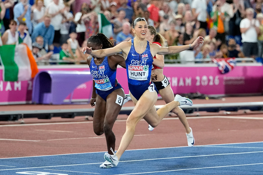 Amy Hunt of Britain crosses the finish line to win the women's 200 meters final at the European Athletics Championships in Birmingham, England, Thursday, Aug. 13, 2026. (AP Photo/Matthias Schrader)