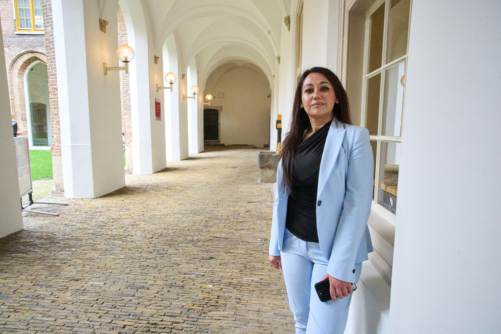 Palwasha Hamzad, who wants the Dutch election to be not about migration, but about tackling the chronic housing shortages in the Netherlands, poses for a portrait at the historic town hall in Haarlem, Netherlands, Friday, Oct. 17, 2025. (AP Photo/Peter Dejong)