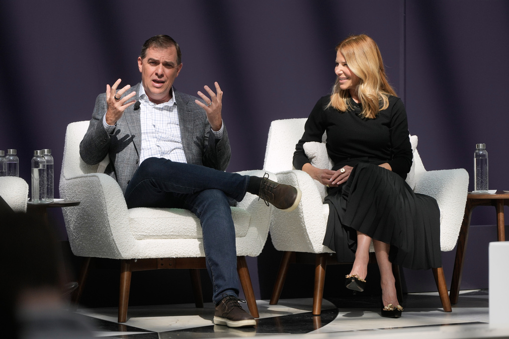 Matt Garman, CEO of AWS, left, speaks next to Denise Dresser, chief revenue officer of OpenAI, at a What's Next with AWS event Tuesday, April 28, 2026, in San Francisco. (AP Photo/Jeff Chiu)