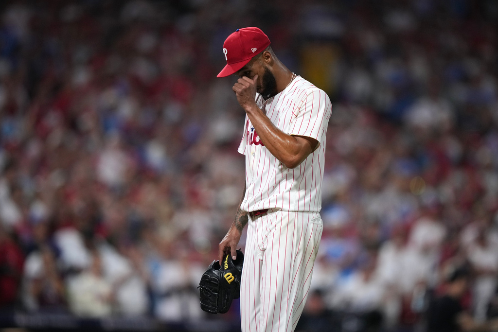 Philadelphia Phillies pitcher Cristopher Sánchez wipes his face after being pulled during the sixth inning in Game 1 of baseball's National League Division Series against the Los Angeles Dodgers, Saturday, Oct. 4, 2025, in Philadelphia. (AP Photo/Matt Slocum)
