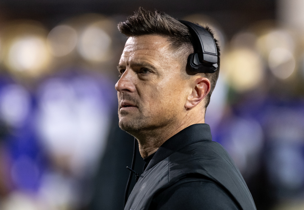 James Madison head coach Bob Chesney looks up at the stands during the first half of the Sun Belt championship NCAA college football game against Troy in Harrisonburg, Va., Friday, Dec. 5, 2025. (Daniel Lin/Daily News-Record Via AP)