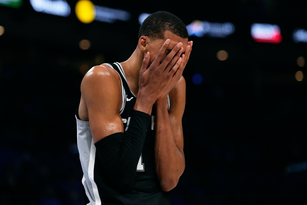 San Antonio Spurs forward Victor Wembanyama reacts during the second overtime of Game 1 in a third-round NBA basketball playoffs series against the Oklahoma City Thunder Monday, May 18, 2026, in Oklahoma City. (AP Photo/Tony Gutierrez)