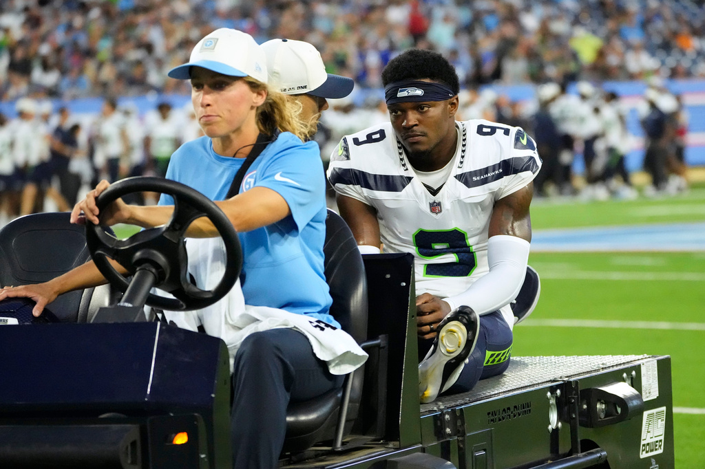 Seattle Seahawks defensive back Bud Clark (9) is carted off the field after getting injured during the first half of a preseason NFL football game against the Tennessee Titans, Sunday, Aug. 23, 2026, in Nashville, Tenn. (AP Photo/George Walker IV)