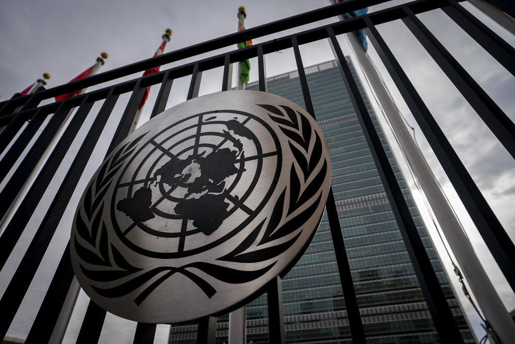 FILE - The symbol of the United Nations is displayed on the main gate outside UN headquarters, Feb. 24, 2022, in New York. (AP Photo/John Minchillo, file)