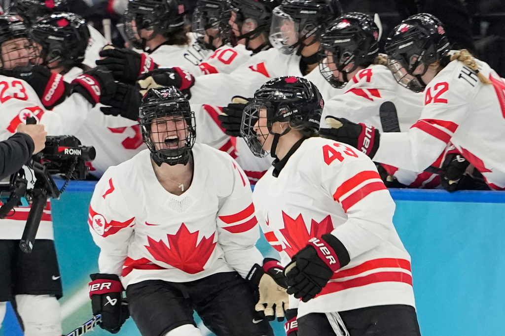 Canada's Kristin O'Neill (43) celebrates after scoring her side's opening goal during a women's ice hockey gold medal game between the United States and Canada at the 2026 Winter Olympics, in Milan, Italy, Thursday, Feb. 19, 2026. (AP Photo/Hassan Ammar)