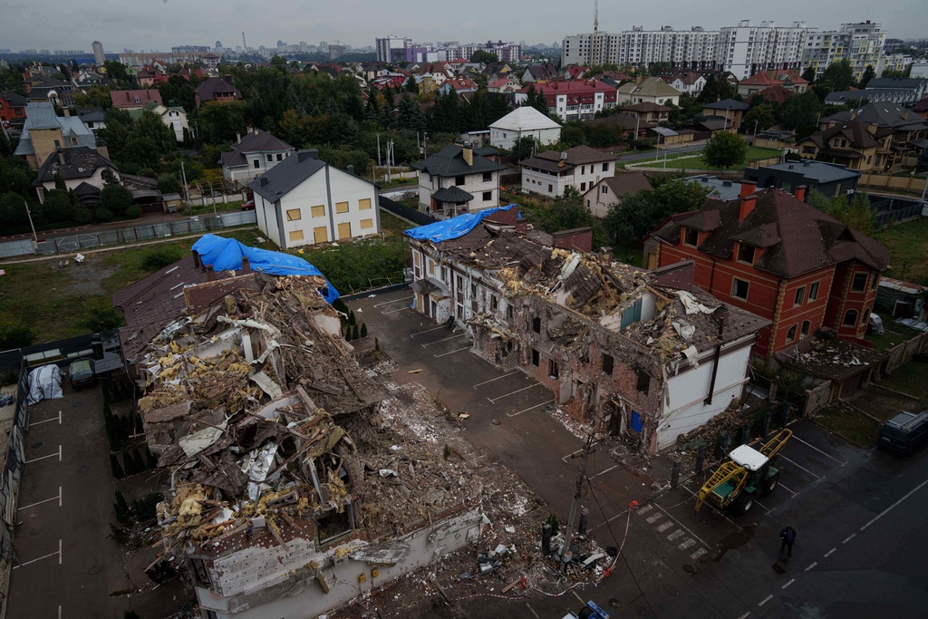 Residential houses are seen destroyed after a Russian strike in Kyiv, Ukraine, on Monday, Sept. 29, 2025. (AP Photo/Evgeniy Maloletka)