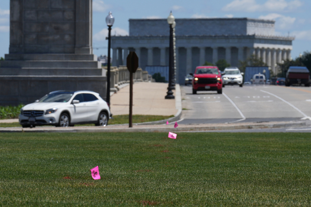 FILE - Flags placed by workers are pictured in the Memorial Circle, where President Donald Trump has proposed building an arch to commemorate the United States' 250th anniversary, Friday, May 15, 2026, in Washington. (AP Photo/Jacquelyn Martin, File)