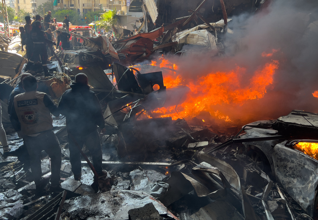Rescuers gather at the site of an Israeli airstrike in central Beirut, Lebanon, Wednesday, April 8, 2026. (AP Photo/Hussein Malla)