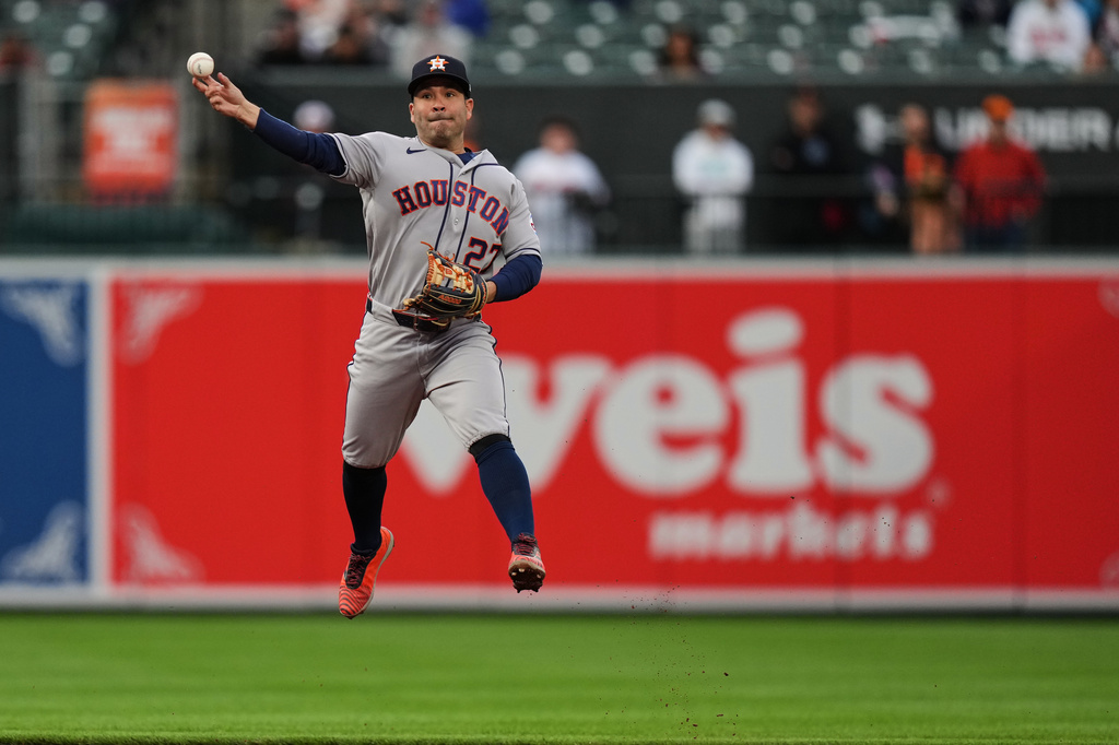 Houston Astros second baseman Jose Altuve (27) throws to first to make the out against Baltimore Orioles' Pete Alonso during the first inning of a baseball game, Tuesday, April 28, 2026, in Baltimore. (AP Photo/Stephanie Scarbrough)