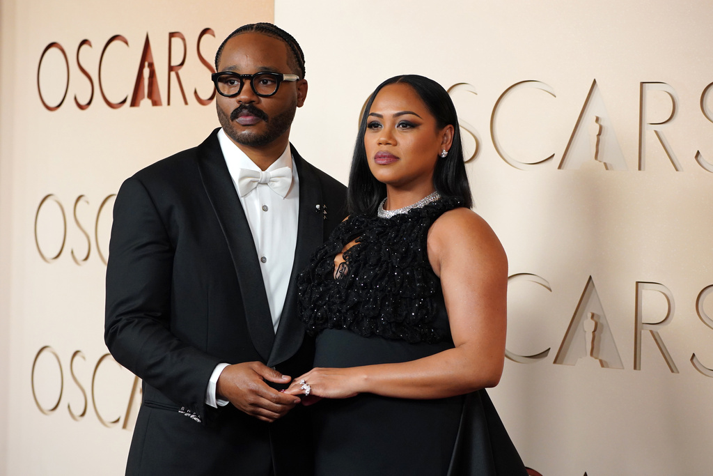 Ryan Coogler, left ,and Zinzi Evans arrive at the Oscars on Sunday, March 15, 2026, at the Dolby Theatre in Los Angeles. (Photo by Jordan Strauss/Invision/AP)