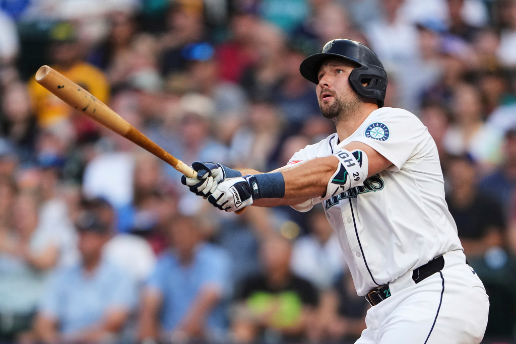 FILE - Seattle Mariners designated hitter Cal Raleigh hits a solo home run against the San Diego Padres during the first inning of a baseball game Monday, Aug. 25, 2025, in Seattle. (AP Photo/Lindsey Wasson, File)