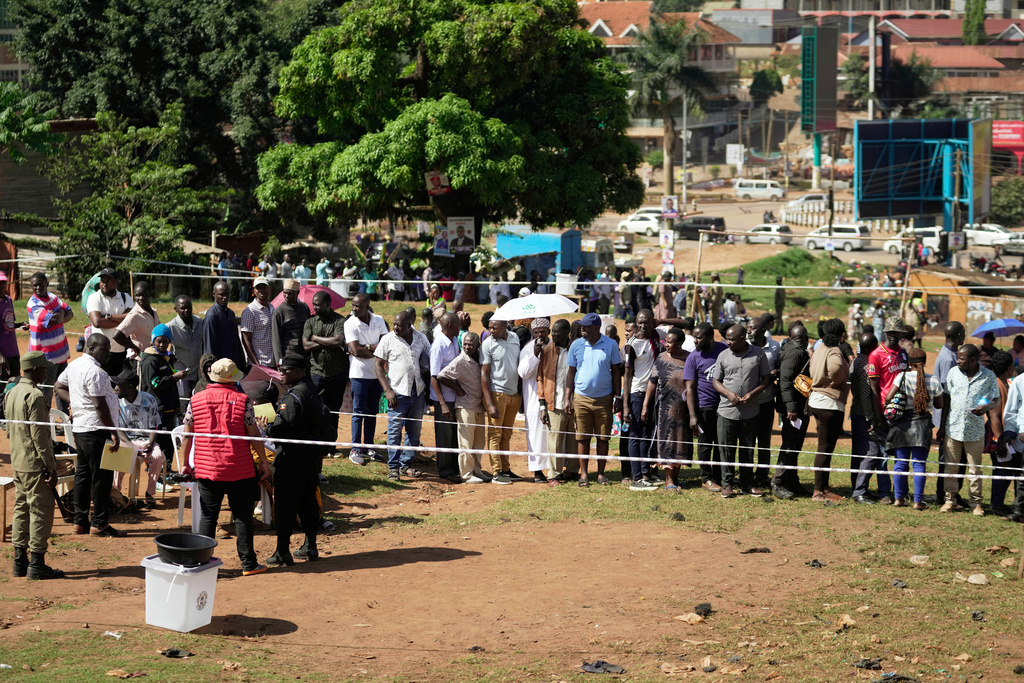 Voters line up to cast their ballots at a polling station, during the presidential election, in the capital, Kampala, Uganda, Thursday, Jan. 15, 2026. (AP Photo/Brian Inganga)
