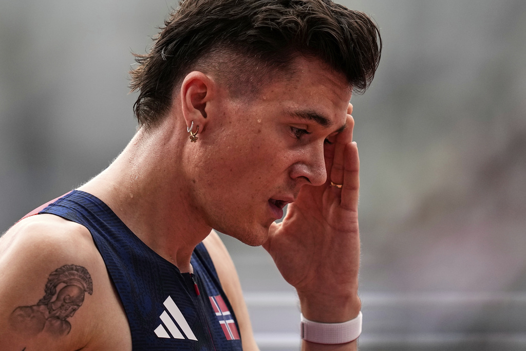 Norway's Jakob Ingebrigtsen reacts after finishing a men's 1,500 meters heat at the World Athletics Championships in Tokyo, Sunday, Sept. 14, 2025. (AP Photo/Petr David Josek)