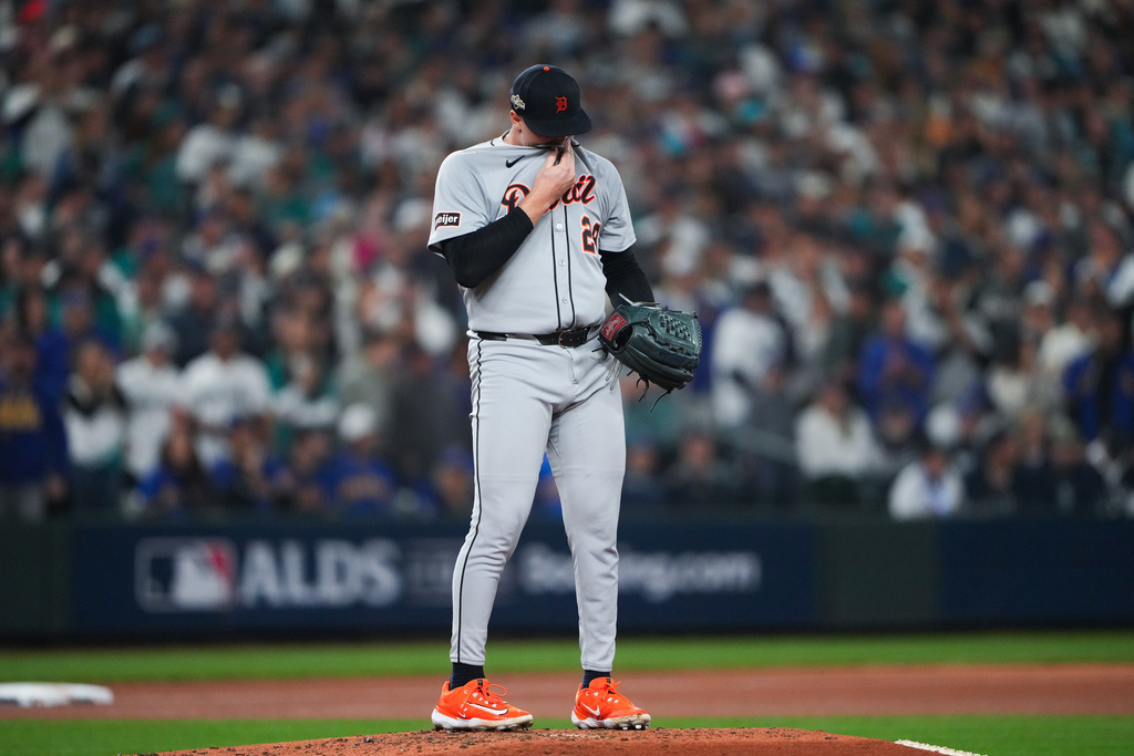 Detroit Tigers pitcher Tarik Skubal wipes his face during the third inning in Game 5 of baseball's American League Division Series against the Seattle Mariners, Friday, Oct. 10, 2025, in Seattle. (AP Photo/Lindsey Wasson)