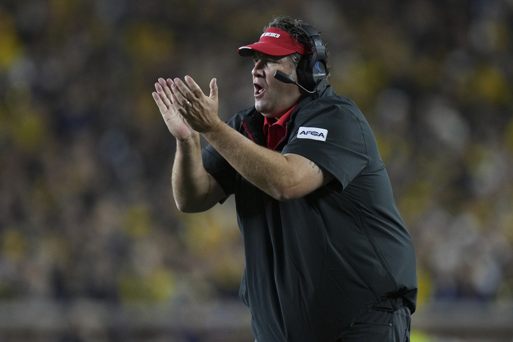New Mexico head coach Jason Eck reacts during the first half of an NCAA college football game against Michigan, Saturday, Aug. 30, 2025, in Ann Arbor, Mich. (AP Photo/Ryan Sun)