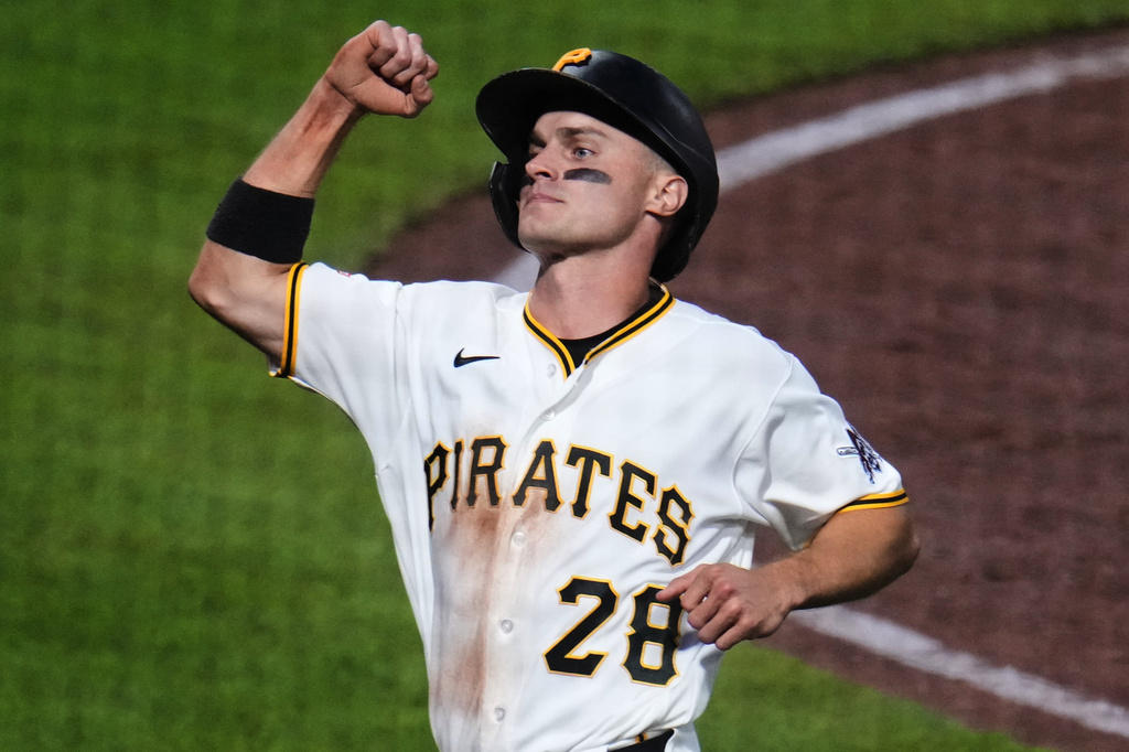 Pittsburgh Pirates' Jake Mangum celebrates after scoring on a single by Brandon Lowe off Arizona Diamondbacks pitcher Merrill Kelly during the sixth inning of a baseball game in Pittsburgh, Monday, July 27, 2026. (AP Photo/Gene J. Puskar)
