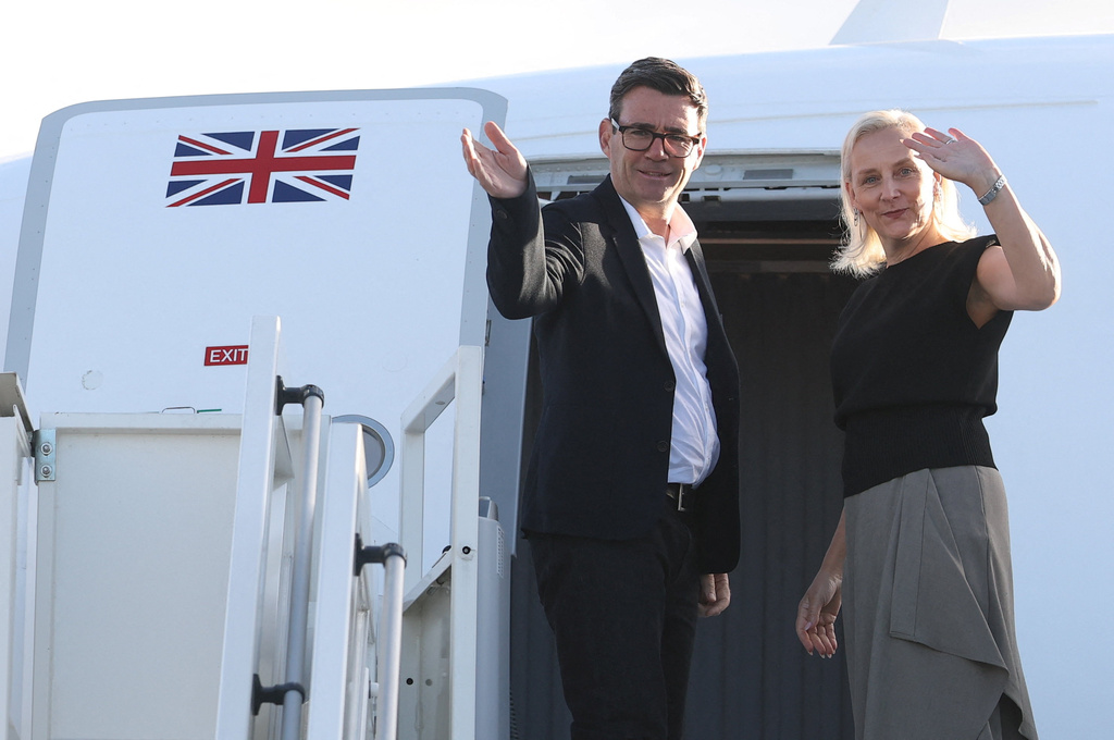 Britain's Prime Minister Andy Burnham and his wife Marie-France van Heel board a plane for the United States, at Stansted Airport, Stansted, England, Monday Sept. 21, 2026, to attend the UN General Assembly in New York. (Toby Melville/Pool Photo via AP)