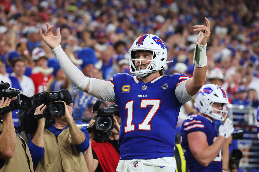 Buffalo Bills quarterback Josh Allen (17) celebrates his rushing touchdown against the Detroit Lions during the second half of an NFL football game in Orchard Park, N.Y., Thursday, Sept. 17, 2026. (AP Photo/Jeffrey T. Barnes )