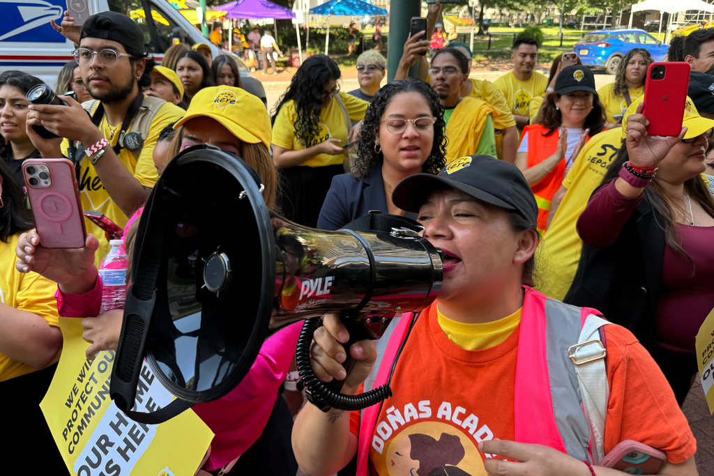 FILE - DACA supporter Claudia Valdivia wields a megaphone at a rally outside federal appeals court in New Orleans on Thursday, Oct. 10 ,2024. (AP Photo/Jack Brook, File)