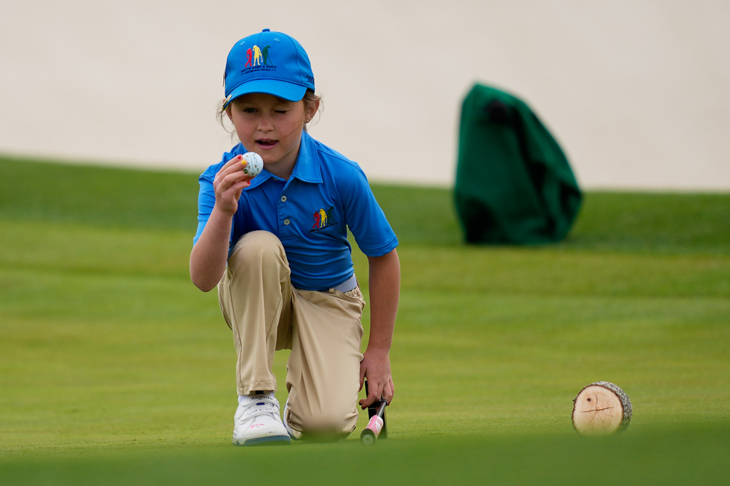 Sophia Eagan lines up a putt in the Drive Chip & Putt National Finals at the Augusta National Golf Club, Sunday, April 5, 2026, in Augusta, Ga. (AP Photo/David J. Phillip)
